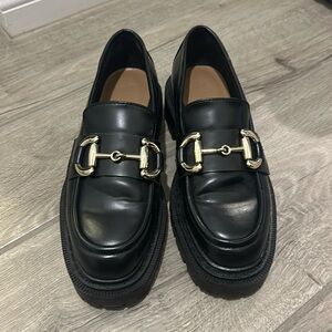 Black platform lug loafers
